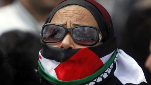 Commemorating the events of 1976, pictured is one of the demonstrators in Jerusalem, silenced by the blood-stained past of Palestine.