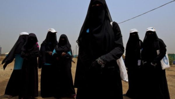 Shrouded in black, are these women the last of an ending era? - Shown for illustrative purposes.