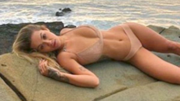 Nude ambition: Rita Ora returned to the photo-sharing site to post a stunning shot as she stripped down to just a scanty nude bikini while reclining on a rock (Source: Rita Ora - Instagram)