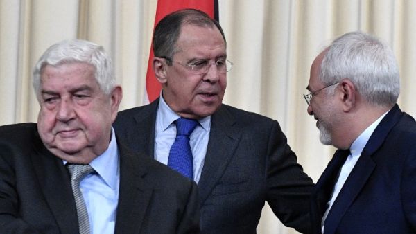 Russian Foreign Minister Sergei Lavrov (C), his Iranian counterpart Mohammad Javad Zarif (R) and Syrian Foreign Minister Walid Muallem (L) leave a hall after a joint press conference after their talks in Moscow on April 14, 2017. (AFP/Alexander Nemenov)