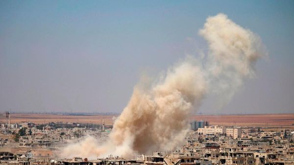 Smoke rises from an airstrike in Syria. (AFP)