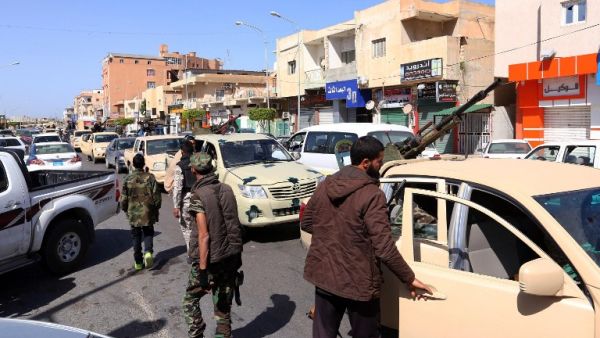 Members of Libyan opposition group Libyan Dawn wait at a checkpoint in Sabratha, after fierce clashes with Daesh militants. (AFP/Mahmud Turkia)