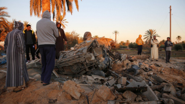 Sabratha residents survey damage in their city. (Twitter)