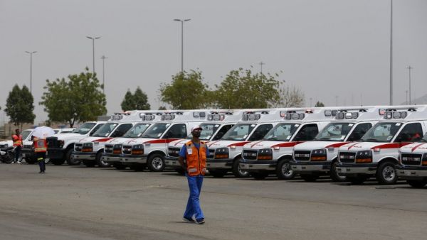 A member of Saudi Red Crescent Authority (SRCA) walks past ambulances waiting at the Hajj pilgrimage in Mecca, Saudi Arabia, on September 6, 2016. (AFP/Ahmad Gharabli)