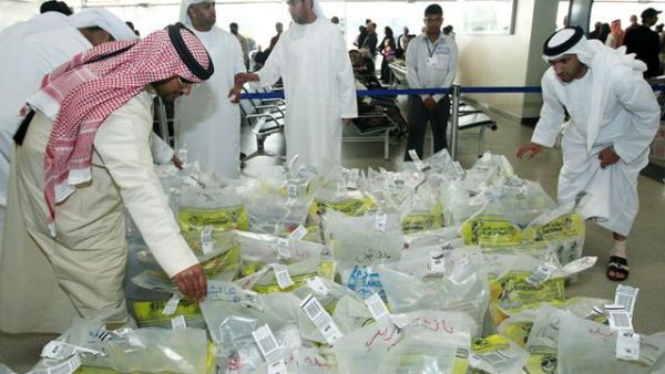 Saudis examine water samples from the Zamzam Well to check for contamination. (AFP/File)