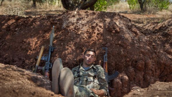 A rebel fighter takes a nap after his night shift in a trench along the highway that connects Idlib city with Latakia, 100m away from the Syrian regime's forces's positions, on July 15, 2013. (Source: AFP/DANIEL LEAL OLIVAS) A rebel fighter takes a nap after his night shift in a trench along the highway that connects Idlib city with Latakia, 100m away from the Syrian regime's forces's positions, on July 15, 2013. (Source: AFP/DANIEL LEAL OLIVAS)