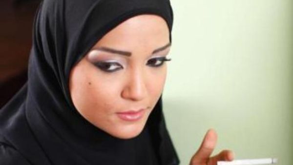 A woman smokes as Bahrain implements strict smoking laws. [14october]