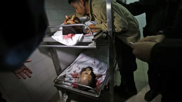 A Palestinian man mourns over the body of a member of the Ezzedine al-Qassam Brigades, killed during an Israeli operation on Khan Younis in the southern Gaza Strip, at a hospital morgue on November 11, 2018. (Said KHATIB / AFP)