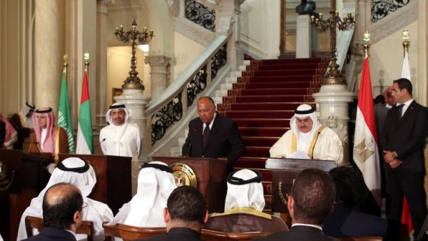 Egyptian Foreign Minister Sameh Shoukry (C) reads a statement while giving a joint press conference with his Saudi, Emirati and Bahraini counterparts on July 5 2017 (Khaled Elfiqi/Pool/AFP)