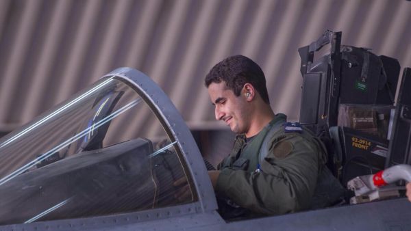 In a handout picture released by the official Saudi Press Agency (SPA), Saudi Arabian air force pilot Prince Khaled bin Salman sits in the cockpit of a fighter jet at an undisclosed location on September 23, 2014. (AFP)