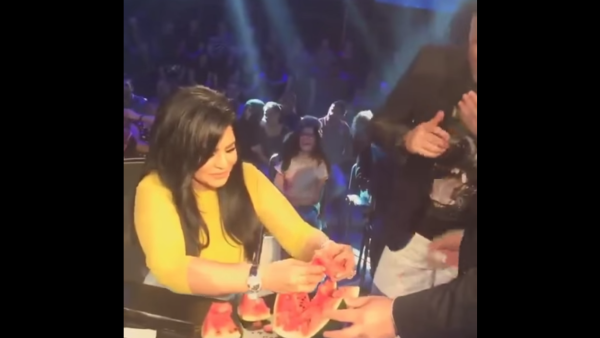 A still of Ahlam eating watermelon live on air on the "Golden Mic" show. (YouTube still)