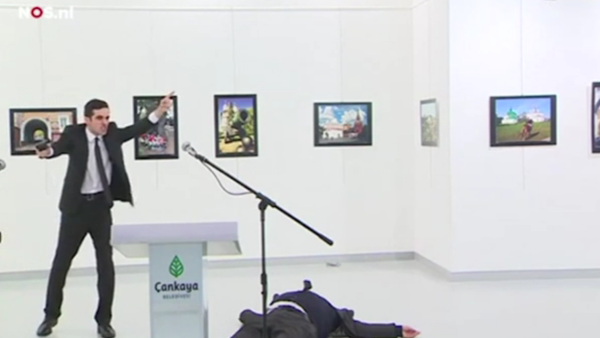 The killer shouted "Allahu Akbar, this is for Aleppo" as he waved his gun around after shooting the ambassador. (Screenshot)