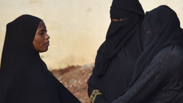 Women in the city of Abijdan in the Ivory Coast wearing face veils and hijabs in July 2015. (AFP Photo/Issouf Sanogo)