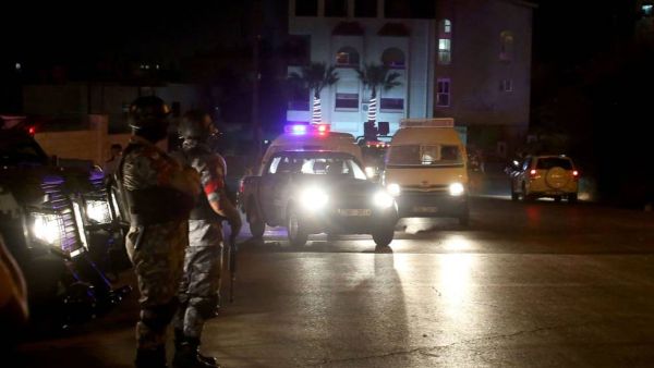 Security forces stand guard outside the Israeli embassy in Amman, Jordan (AFP/File Photo)	