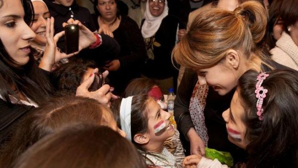 Asma Assad and her children attend a fundraising event in Damascus
