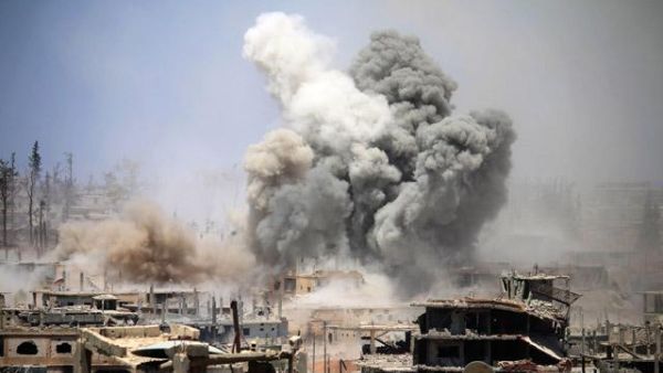 Smoke rises from buildings following a reported air strike on a rebel-held area in the southern Syrian city of Daraa. (AFP)