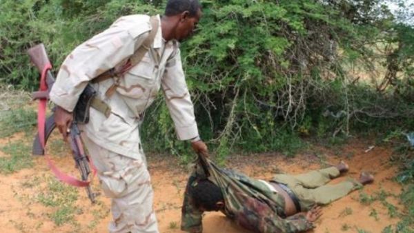 ارشيف/ مسلح يجر جثة رجل 