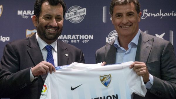 Malaga's new coach Jose Miguel Gonzalez Martin del Campo aka Michel (R) poses with Malaga CF's chairman Sheikh Abdallah Ben Nasser Al-Thani during his official presentation at the Rosaleda stadium in Malaga, on March 8, 2017.
JORGE GUERRERO / AFP