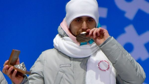 (FILES) In this file photo taken on February 14, 2018, Russia's bronze medallist Aleksandr Krushelnitckii poses on the podium during the medal ceremony for the curling mixed doubles at the Pyeongchang Medals Plaza during the Pyeongchang 2018 Winter Olympic Games in Pyeongchang. Russian curler Alexander Krushelnitsky tested positive for the banned substance meldonium at the Pyeongchang Olympics, the Russian Olympic Committee confirmed on February 20.
Martin BUREAU / AFP