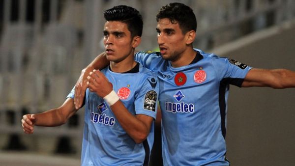 Wydad's striker Achraf Bencharki (L) celebrates his equalising goal with his teammate during the CAF Champions League final football match between Al-Ahly vs Wydad Casablanca at the Borg El Arab Stadium in Alexandria on October 28, 2017.
STRINGER / AFP