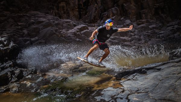 Wakeskating champion and Red Bull athlete Brian Grubb, battles the unforgiving water streams in a volcanic narrow valley In the Jordanian Desert.