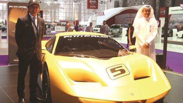 Emerson Fittipaldi (left) and a dignitary from NBK unveil the Supercar Fittipaldi EF7 Vision Gran Turismo by Pininfarina’ at QMS 2017. (Photo: Jayan Orma)