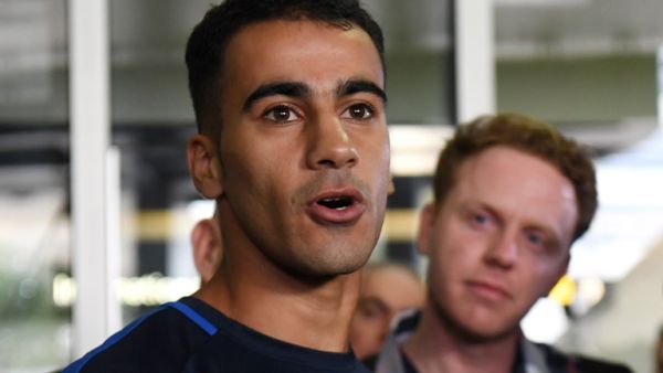 Footballer Hakeem al-Araibi (L) speaks to the media upon his arrival at the airport in Melbourne on February 12, 2019. Refugee footballer Hakeem al-Araibi made a triumphant return to Australia on February 12, ending a two month ordeal that saw him jailed in Thailand and threatened with forced return to his native Bahrain.
WILLIAM WEST / AFP