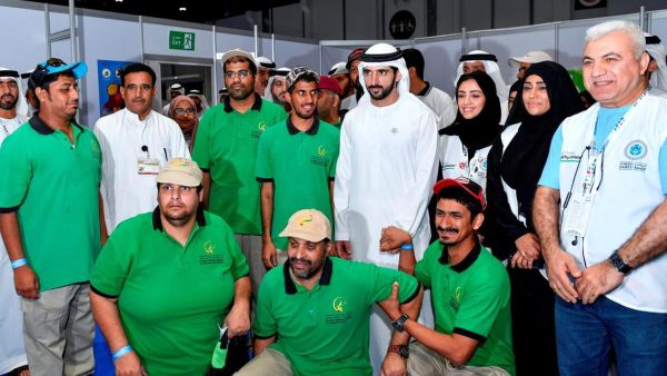 Sheikh Hamdan bin Mohammed poses for a photo with members of the Zayed Higher Organization for Humanitarian Care at the Special Olympics Mena Games. (Photo: Emirates News Agency)