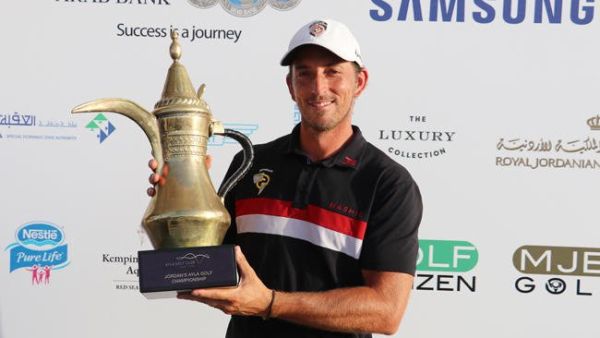 Jamie Elson with the trophy after winning the Ayla Golf Championship on Saturday. (AN photo)