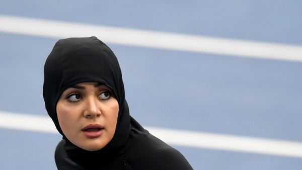 Saudi Arabia's Kariman Abuljadayel looks at the results board after competing in the Women's 100m Preliminary Round during the athletics event at the Rio 2016 Olympic Games at the Olympic Stadium in Rio de Janeiro on August 12, 2016.
PEDRO UGARTE / AFP