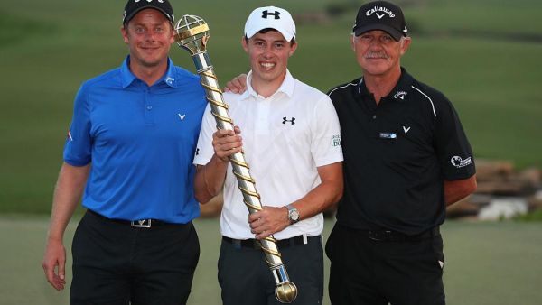 Matt Fitzpatrick poses with the trophy and Coaches Mike Walker (L) and Pete Cowen (R) following his victory during day four of the DP World Tour Championship at Jumeirah Golf Estates on November