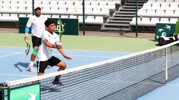 Omani debutant Muneer Al Rawahi hits a return as teammate Mohammed Al Nabhani looks on during their doubles match against Kyrgyzstan's Evgeniy Babak and Georgy Kotlyarevsky on Wednesday. Photo - Supplied