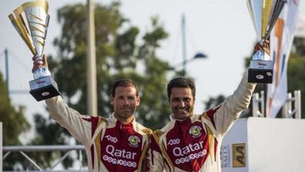 Qatar’s Nasser al-Attiyah (right) and co-driver Mathhieu Baumel celebrate their Cyprus Rally win. (Photo: Gulf Times)