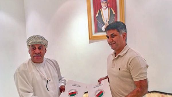 Tahir Zaman (right) and OHA president Talib al Wahaibi after signing the deal on Monday night (Photo: Muscat Daily)