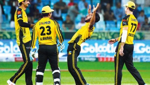Peshawar Zalmi’s Liam Dawson drives the ball against Islamabad United at the Dubai Cricket Stadium. (Photo: PSL Twitter)