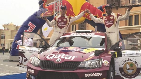 Qatar’s Nasser Saleh al-Attiyah (R) and co-driver Matthieu Baumel celebrate their Kuwait Rally win yesterday (source: Gulf Times)