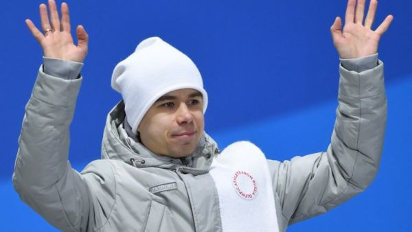 Russia's bronze medallist Semen Elistratov waves on the podium during the medal ceremony for the Men's short track 1500m at the Pyeongchang Medals Plaza during the Pyeongchang 2018 Winter Olympic Games in Pyeongchang on February 11, 2018.
Martin BERNETTI / AFP