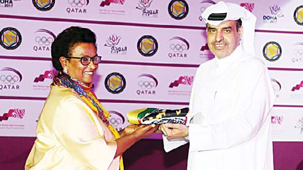 Sheikha Naeema Al-Ahmad Al-Sabah receives the flag (Photo: Arab Times)