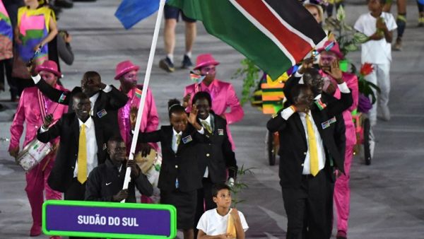 South Sudan's flagbearer Guor Marial leads his delegation during the opening ceremony of the Rio 2016 Olympic Games at the Maracana stadium in Rio de Janeiro on August 5, 2016.
PEDRO UGARTE / AFP