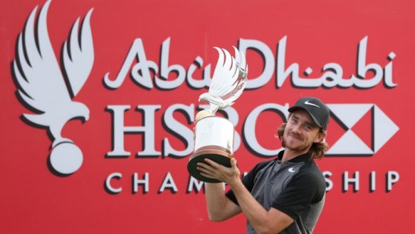 Tommy Fleetwood of England poses with the winner's trophy during the final day of the Abu Dhabi Golf Championship in the capital of the United Arab Emirates on January 22, 2017.
KARIM SAHIB / AFP