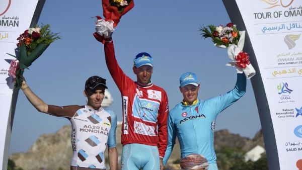 Italian Vincenzo Nibali (C) of Astana Pro Team, French Romain Bardet of AG2R La Mondiale (L) and Norwegian Edvald Baosson Hagen (R) of Dimension Data celebrate on the podium after winning the sixth and final stage of the seventh cycling Tour of Oman between Muscat and Mutrah Corniche, on February 21, 2016. Vincenzo Nibali won the Tour of Oman for the Astana team after Norwegian Alexander Kristoff took the sixth and final stage in a sprint finish.