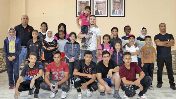 Nineteen-year-old Waleed Abu Nada (middle) poses for a group photo with the refugees participating in the Champ Camp programme in Al Baqaa camp recently (Photo: Waleed Abu Nada)