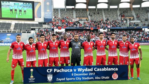 Members of Wydad Casablanca's team pose before the start of their FIFA Club World Cup quarter-final match against CF Pachuca at Zayed Sports City Stadium in the Emirati capital Abu Dhabi on December 9, 2017.
GIUSEPPE CACACE / AFP