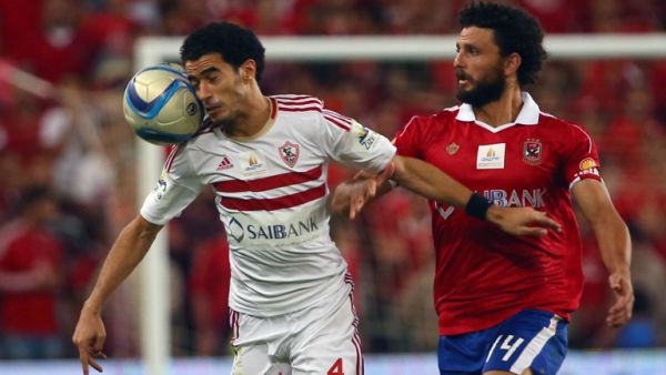 Zamalek's Omar Gaber vies with Al-Ahly's Hossam Ghaly (R) during the Egypt super cup football match between Al-Ahly SC and Zamalek Egyptian football clubs, October 15, 2015 at Sheik Hazza Bin Zayed stadium in Al-Ain, UAE. AFP PHOTO / MARWAN NAAMANI

MARWAN NAAMANI / AFP