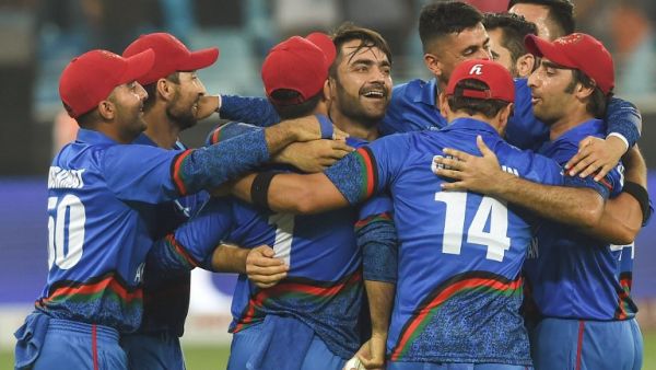 Afghan cricketer Rashid Khan (C), captain Asghar Afghan (R) celebrates with teammate after Match tied during the one day international (ODI) Asia Cup cricket match between Afghanistan and India at the Dubai International Cricket Stadium in Dubai on September 25, 2018.
ISHARA S. KODIKARA / AFP