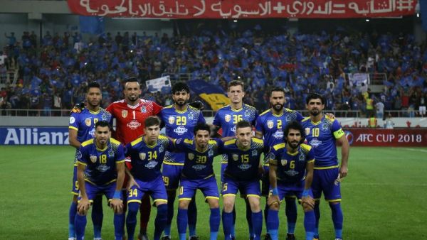Iraq's al-Quwa al-Jawiya club's starting eleven pose for a group picture ahead of their AFC Cup semi-final match for West Asia against Lebanon's Al-Ahed SC at Karbala Sports City stadium on May 8, 2018.
Mohammed SAWAF / AFP