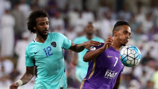 Al-Hilal's defender Yasser Al-Shahrani (L) vies for the ball with Al-Ain's midfielder Caio (R) during their AFC Asian Champions League Group C football match at the Hazza Bin Zayed Stadium in Al-Ain on August 21, 2017.
KARIM SAHIB / AFP