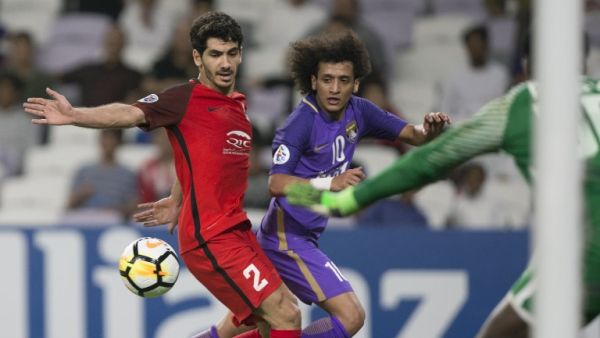 Al Rayyan's Mohamed Alaaeldin (L) vies for the ball against Al Ain's Omar Abdulrahman (R) during the AFC Champions League Round 2 Group (D) match Al-Ain (UAE) vs Al- Rayyan (Qatar) at Hazza Bin Zayed Stadium on February 20, 2018 in the UAE.
NEZAR BALOUT / AFP