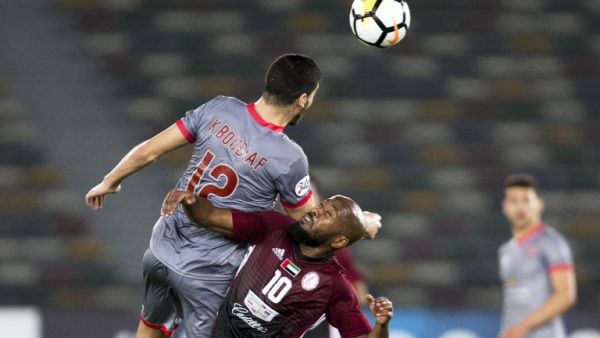 Al-Duhail's Karim Boudiaf (L) vies for the ball against al-Wahda's Ismaeil Matar during their AFC Champions League round 2 group stage football match at the Zayed Sports City Stadium in Abu Dhabi on February 19, 2018.
NEZAR BALOUT / AFP