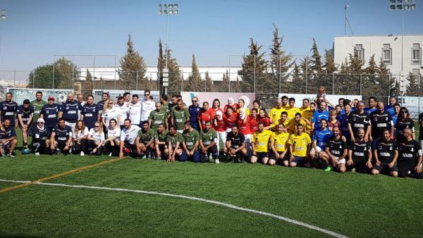 Participants in the ‘Score for Democracy’ event, organized by the EU, pose for a group photo, on Saturday (Photo by Amjad Ghsoun)
